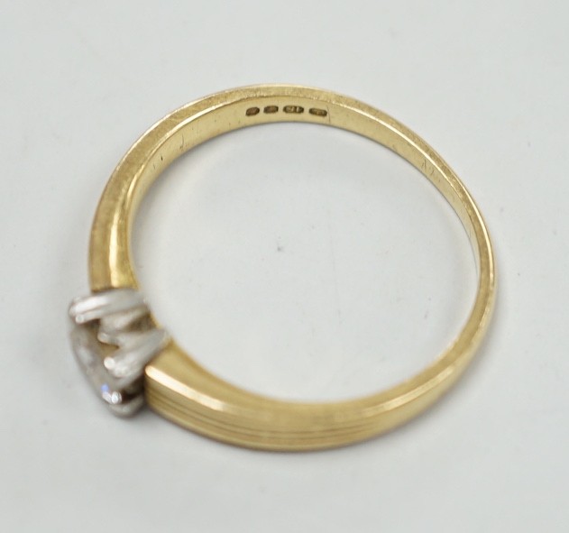 A 1960's 18ct gold and solitaire diamond ring, size M, gross weight 3.6 grams.
